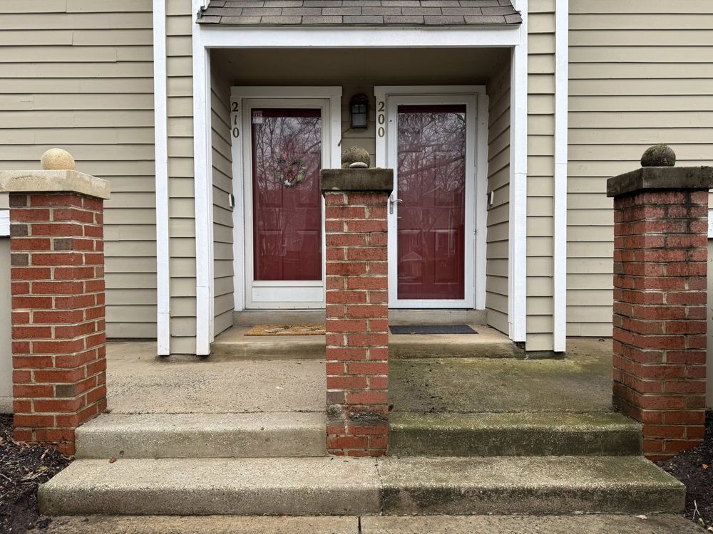 HOA townhome stoop half cleaned, showing the difference
