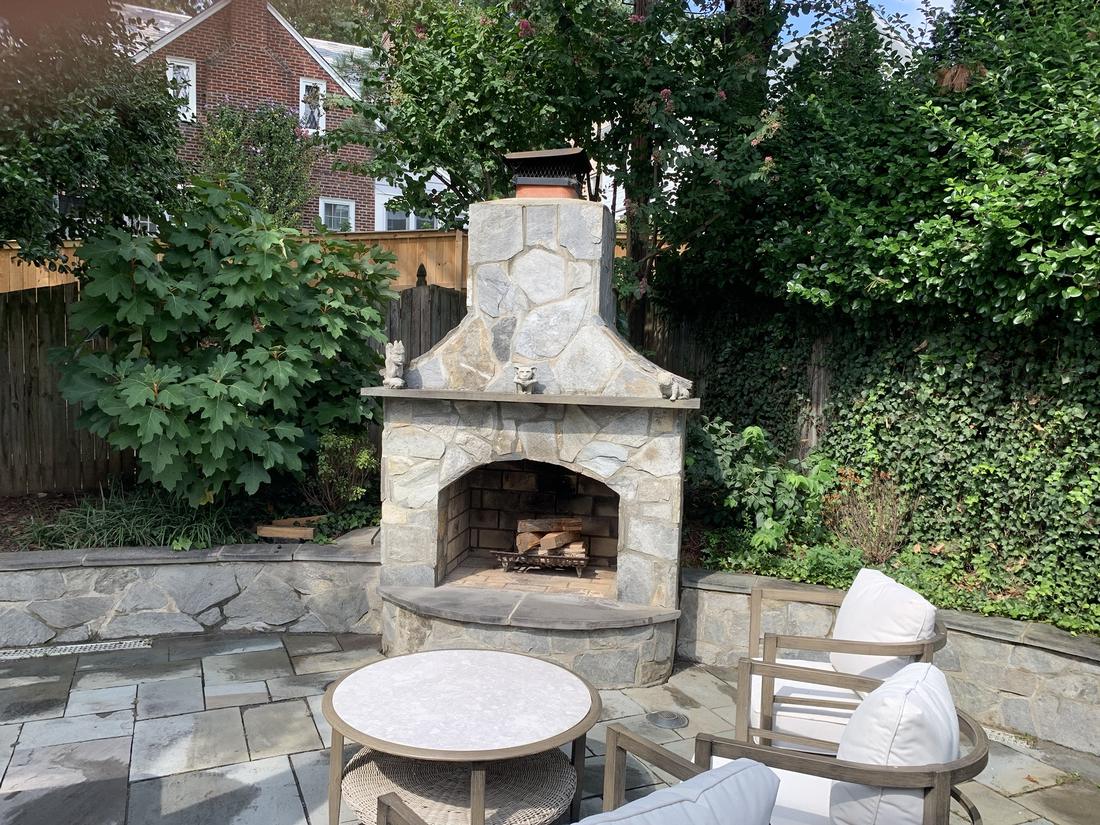 Stone patio and outdoor fireplace after cleaning